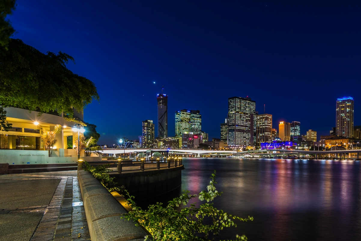 Night lights bridge river skyscrapers