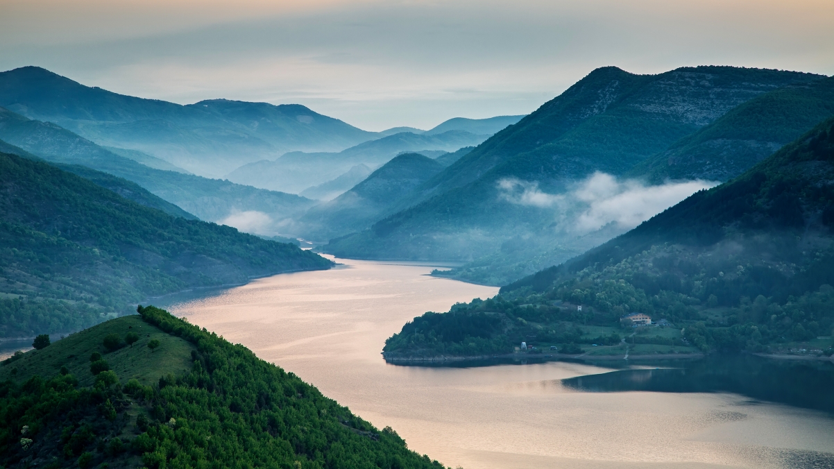Misty sunrise, mountains, rivers and wind