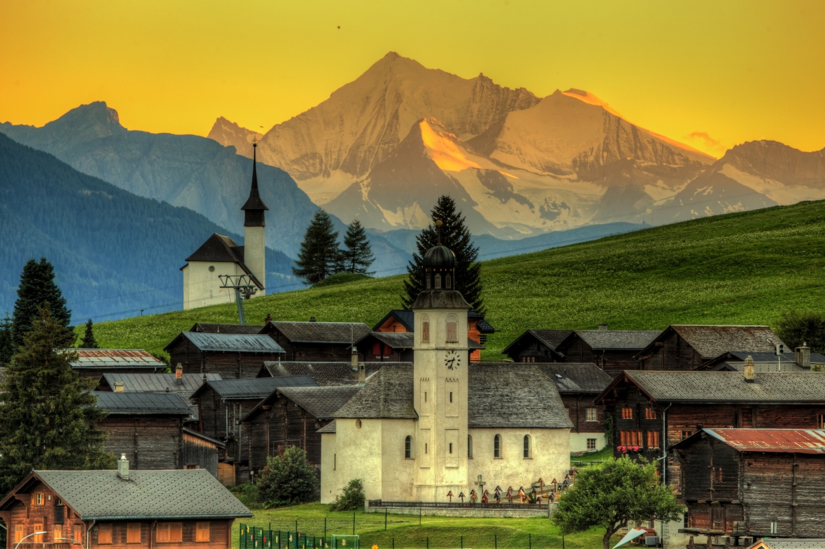Sunset forest houses mountains switzerland