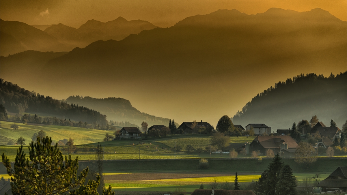 Village in the mountains at dusk in autumn afternoon