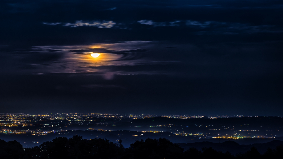 City moon clouds bright night