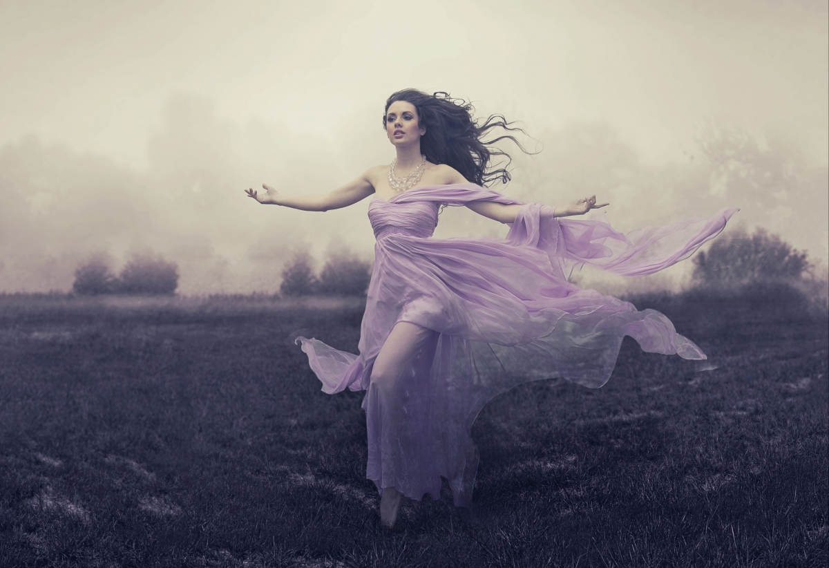 Brown-haired girl in purple dress