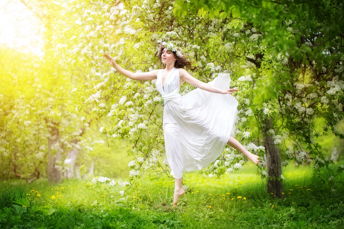 Brown-haired girl in white jumpsuit