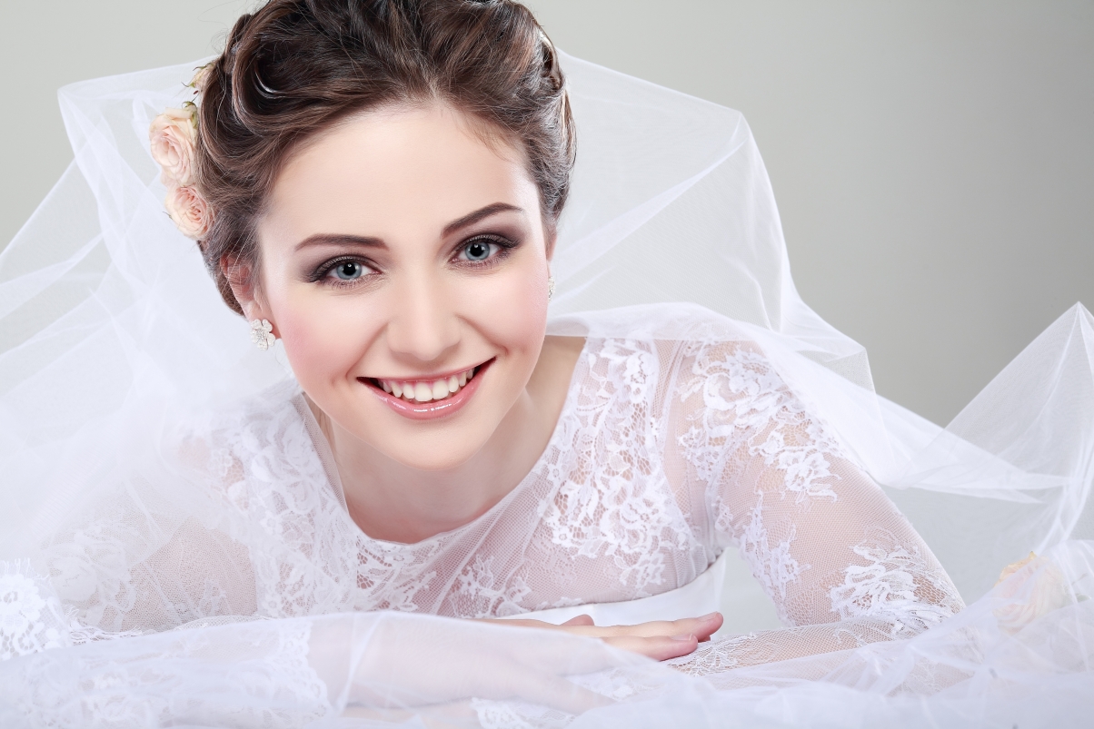 Brown-haired girl smiling with beautiful eyes