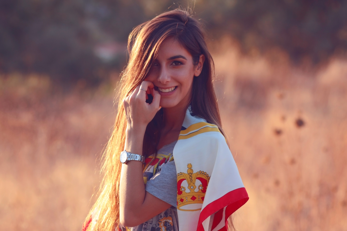 Long-haired beauty smiling watch photo