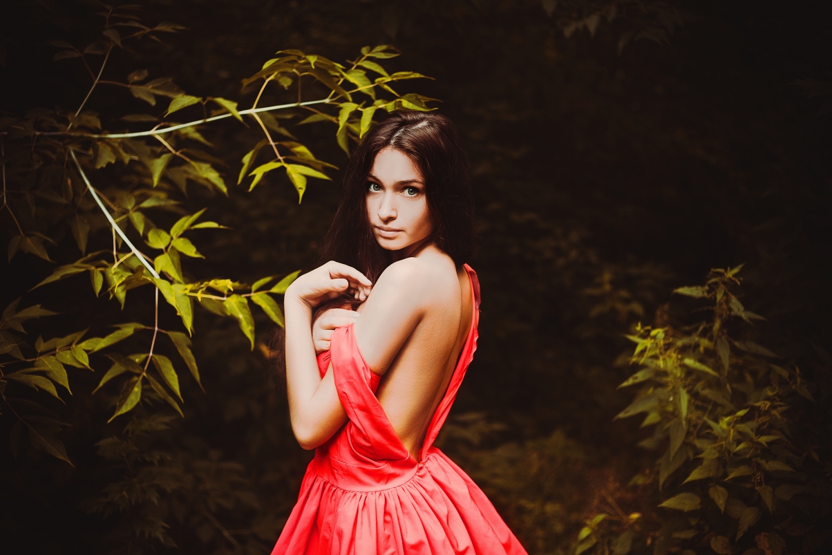 Girl with backless back in the forest