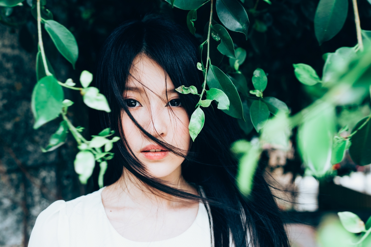 Asian girl brunette woods leaves