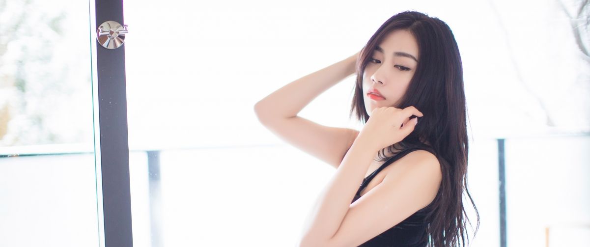 Promise black dress with fish screen wall