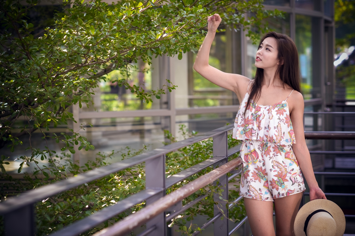 Sexy girl in nightdress in summer park