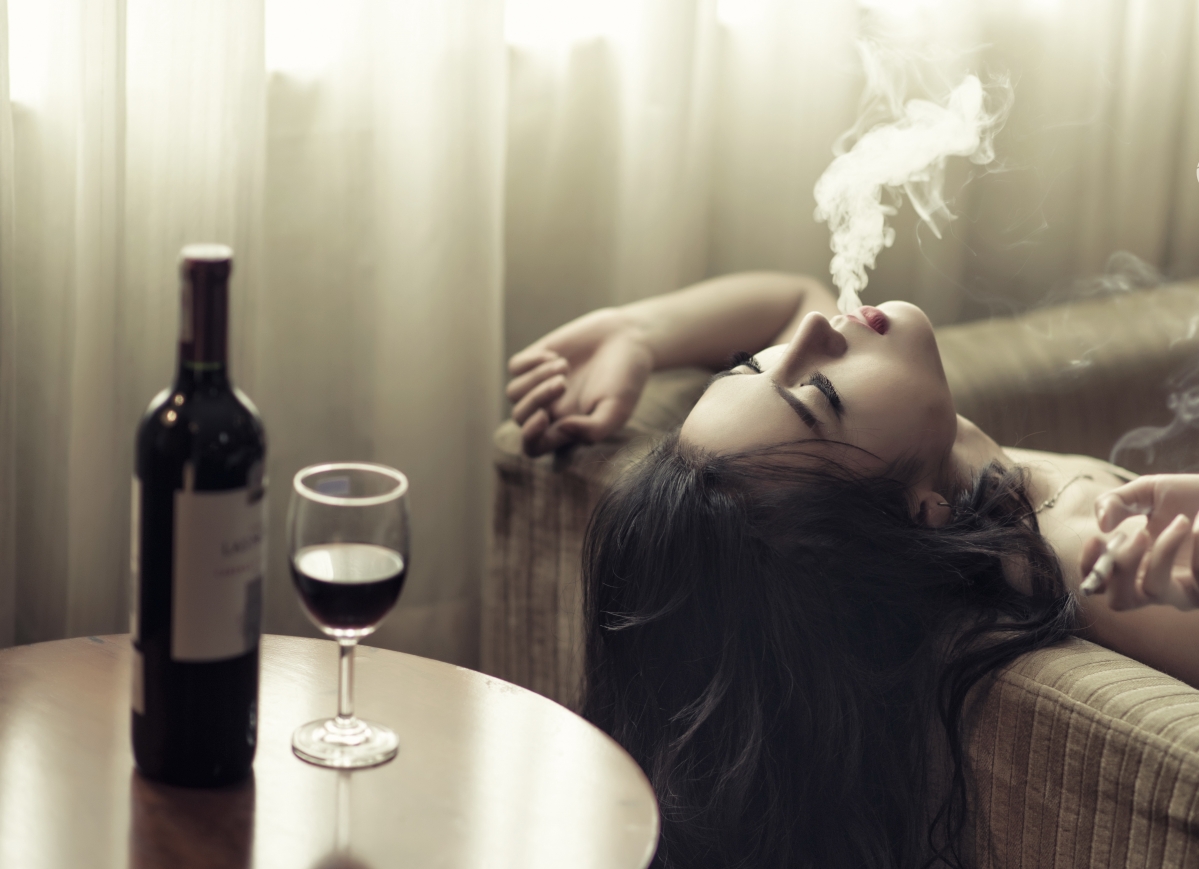 Smoking girl, sofa, wine