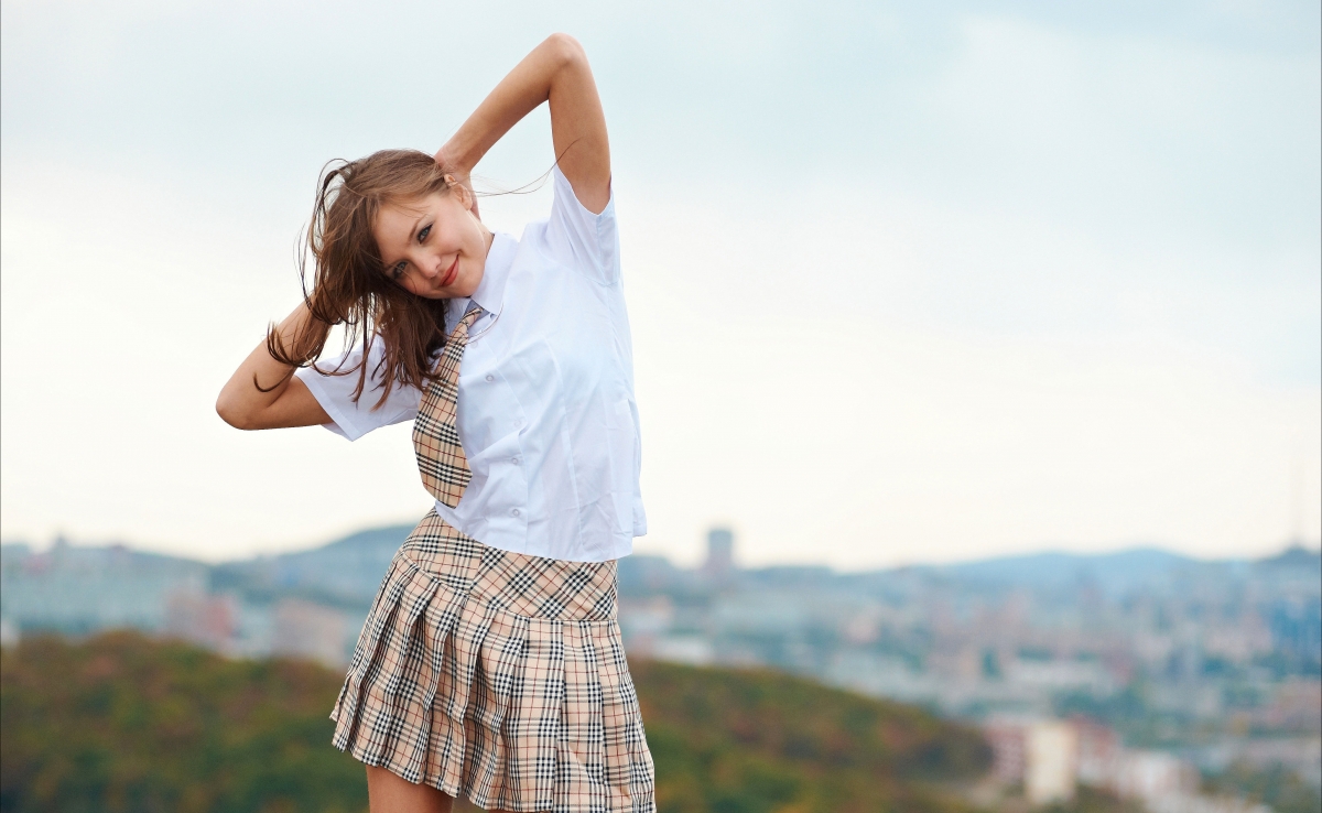 Beautiful girl in a dress in the hills