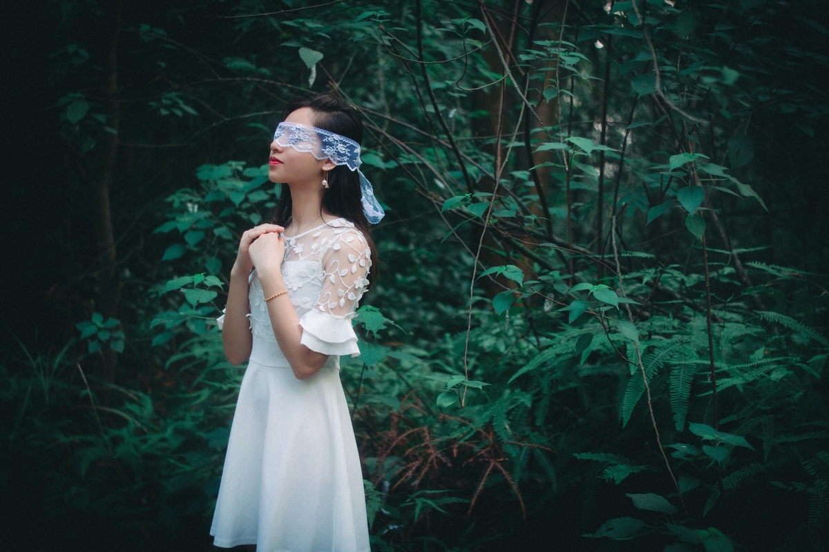 Beautiful woman in forest white skirt