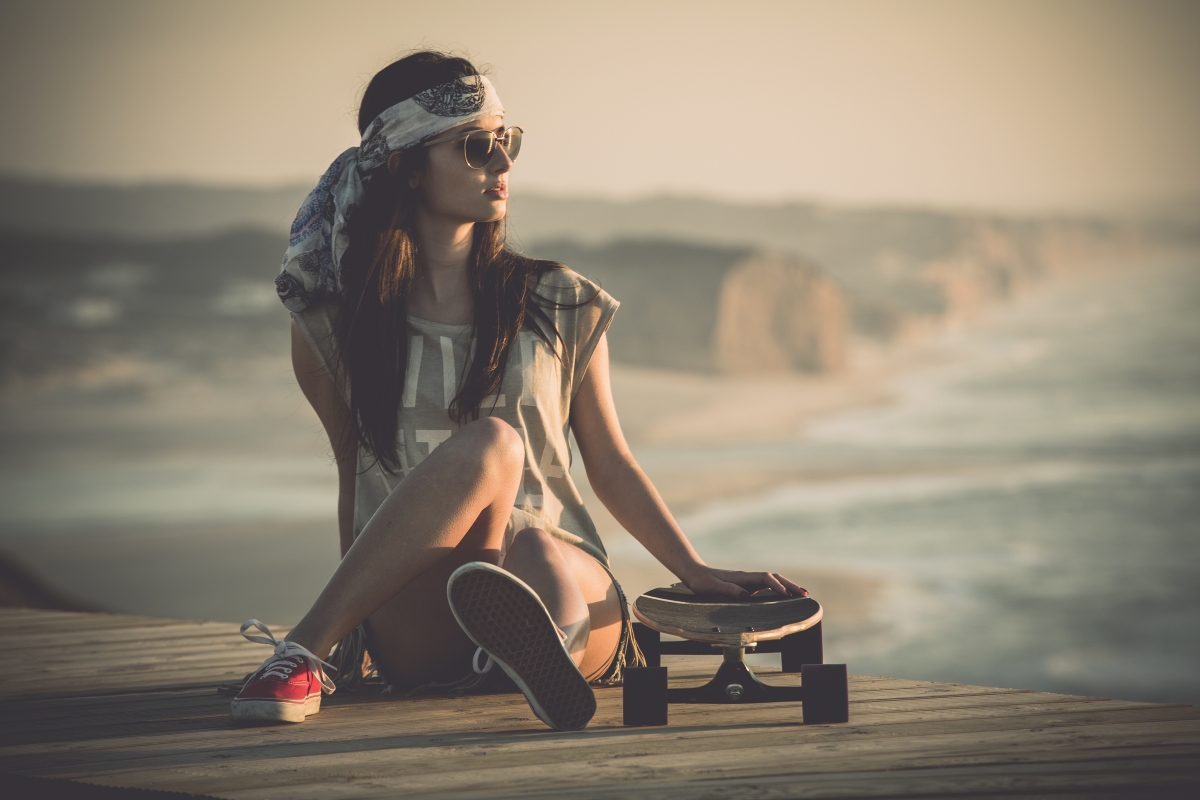 Girl skateboarding sitting position legs 8K beauty