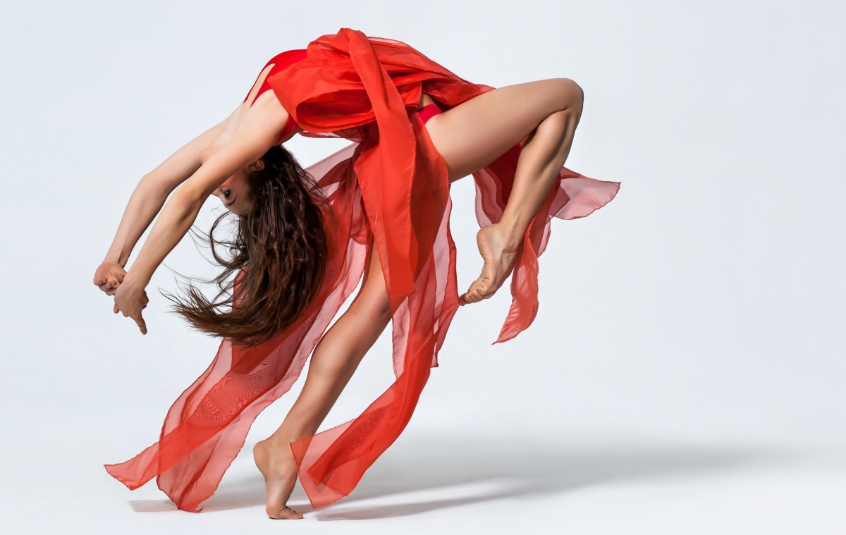 Girl dancer hands bent over red