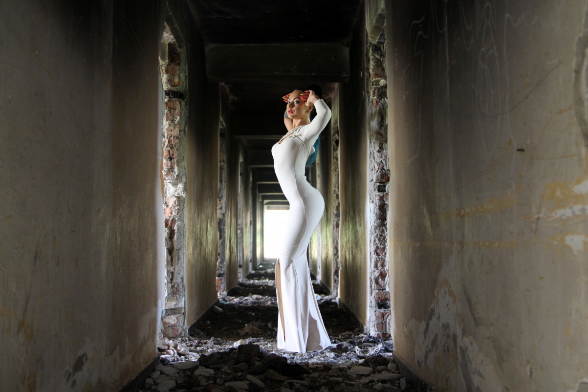 Girl white dress ruined house
