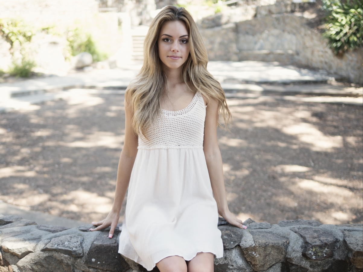 Young smiling woman happy on white