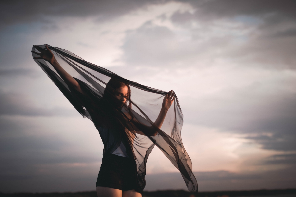 Beautiful girl holding a black veil 6K wallpaper