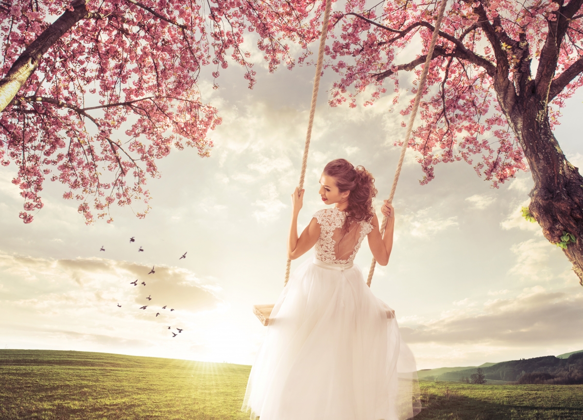 Beautiful bride in the spring meadow