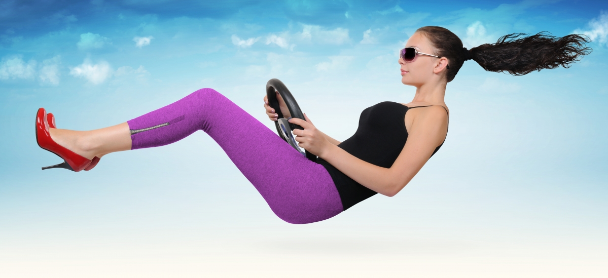 Aerial beauty holding a steering wheel