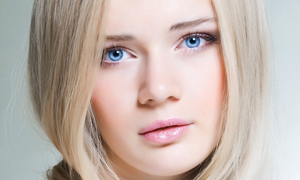 Blond girl face blue