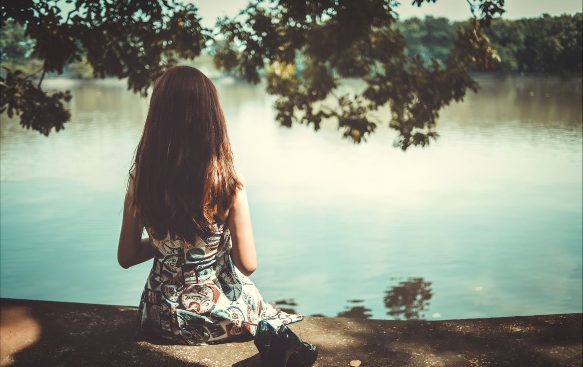 Beautiful 4k wall of beautiful women sitting by the lake