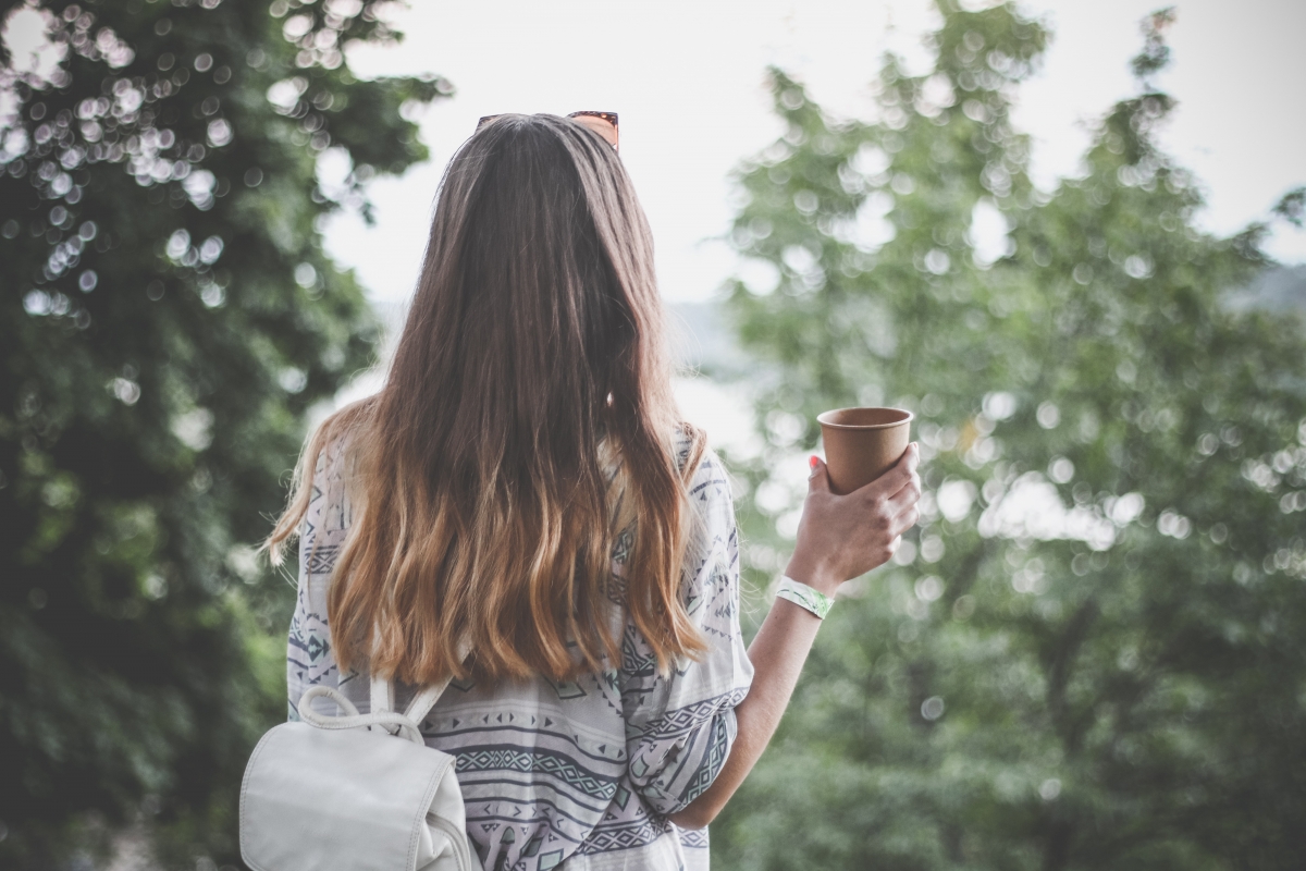Back view of beautiful blur while coffee