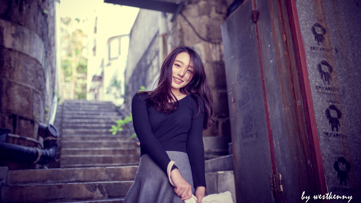 Beautiful smiling woman in black sweater 4k wall