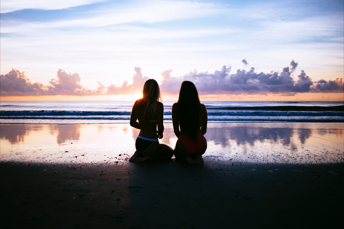 Two beautiful women in bikinis at the beach 5K picture