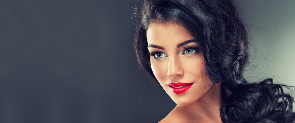 Beautiful model with long curly hair abroad