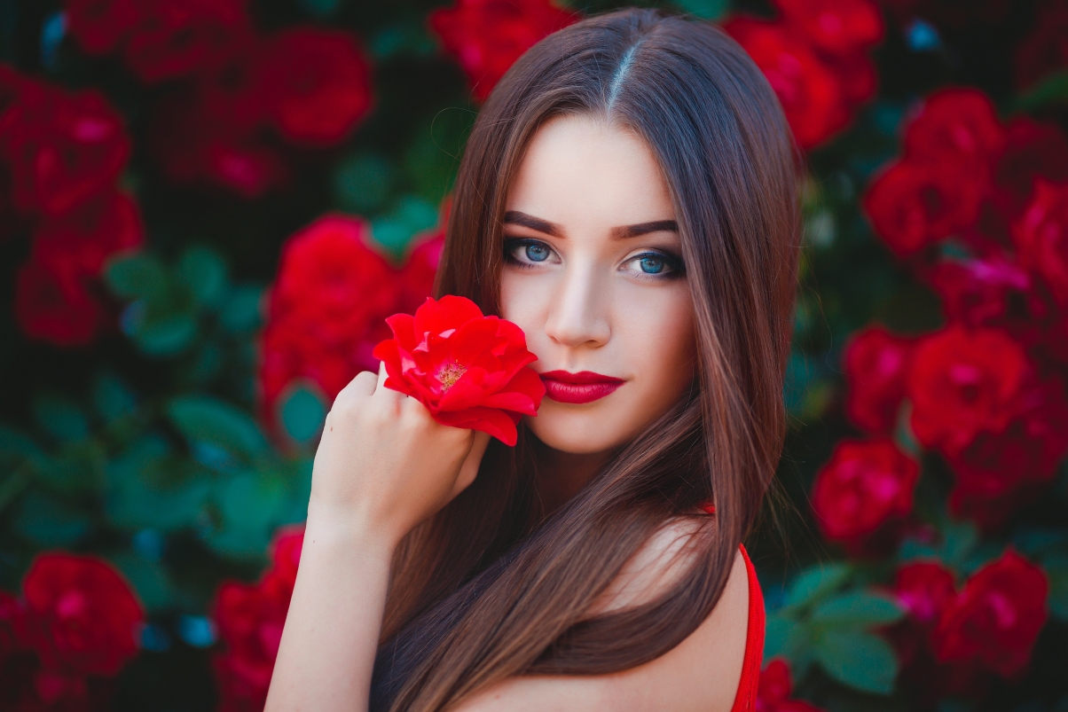 Beautiful foreign model with red flowers