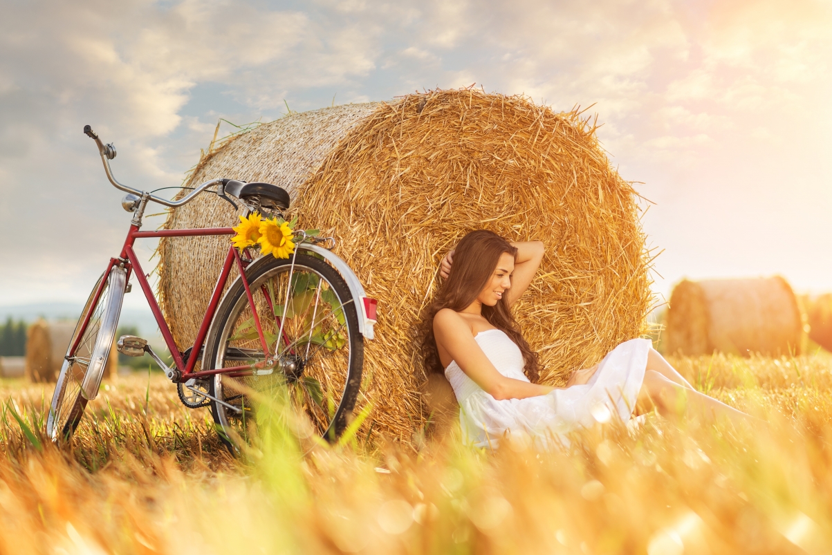 Girl bike with hay stack