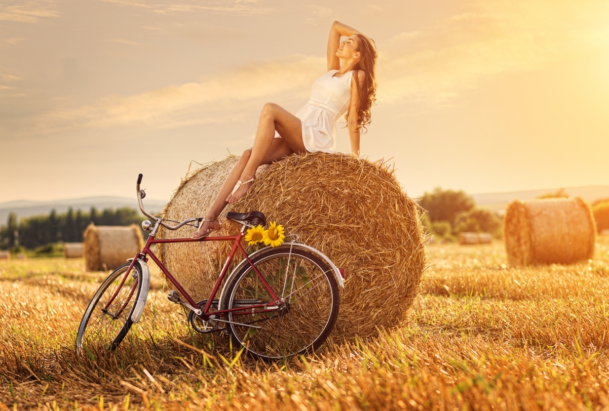 Hay stack girl cycling on his own