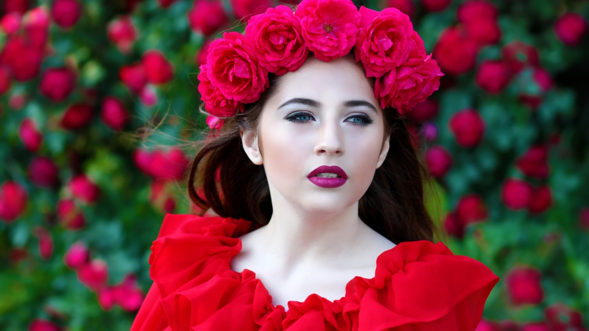 Woman wearing red rose wreath 4K beauty