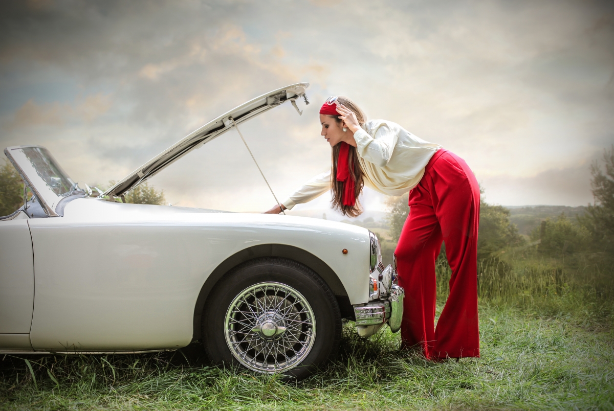 Beautiful fashion woman in white car