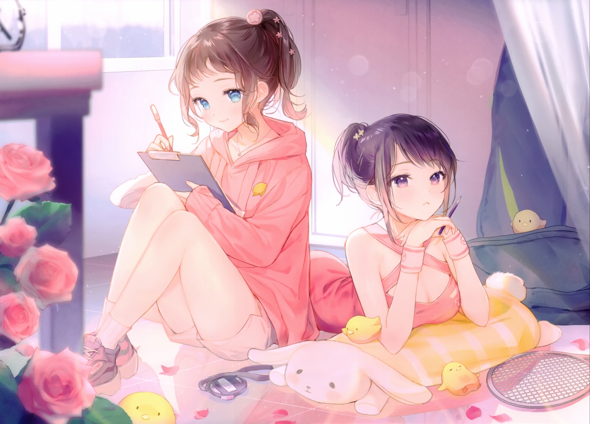Two cute girls drawing and writing