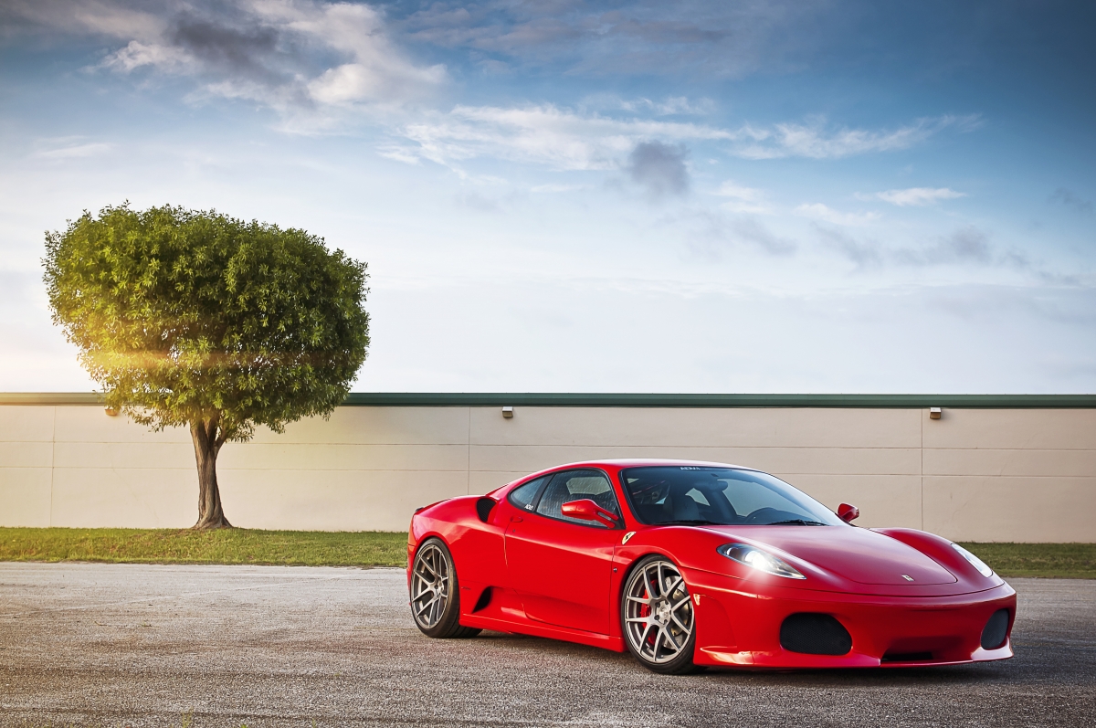 Red Ferrari F430 tree sunlight
