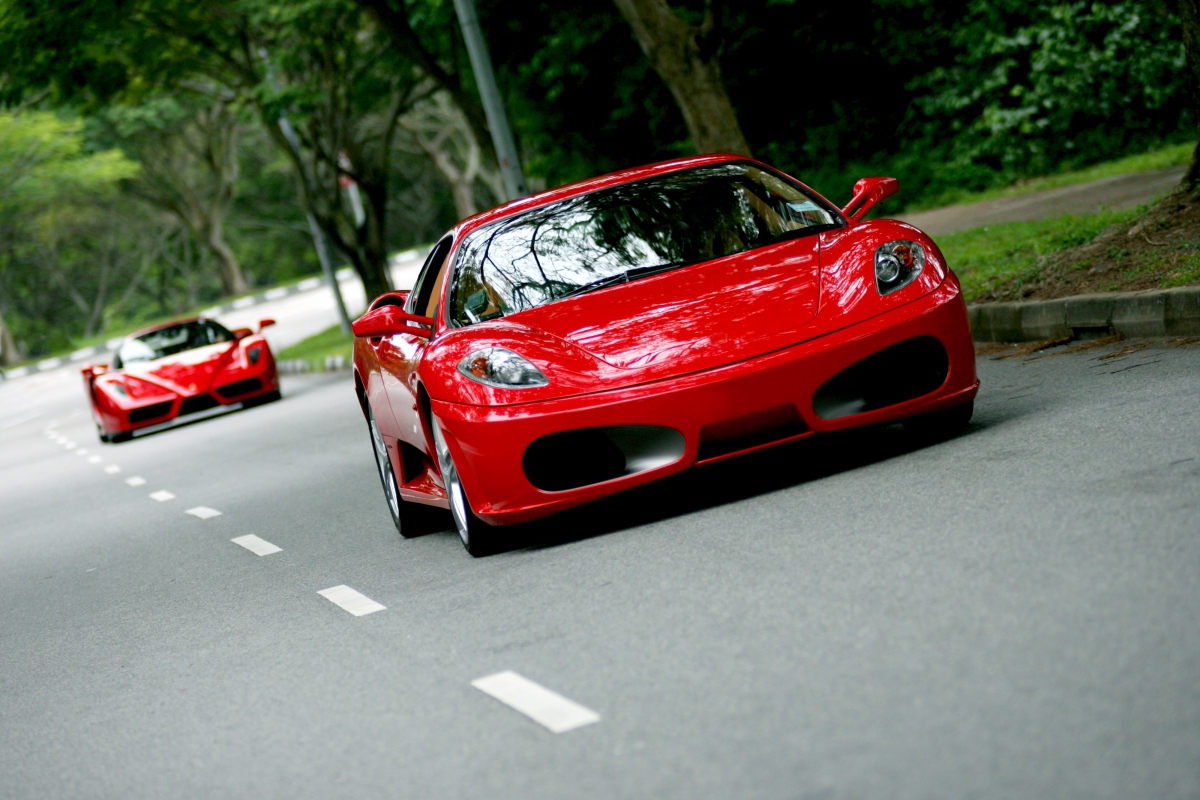 Driving speed red ferrari car