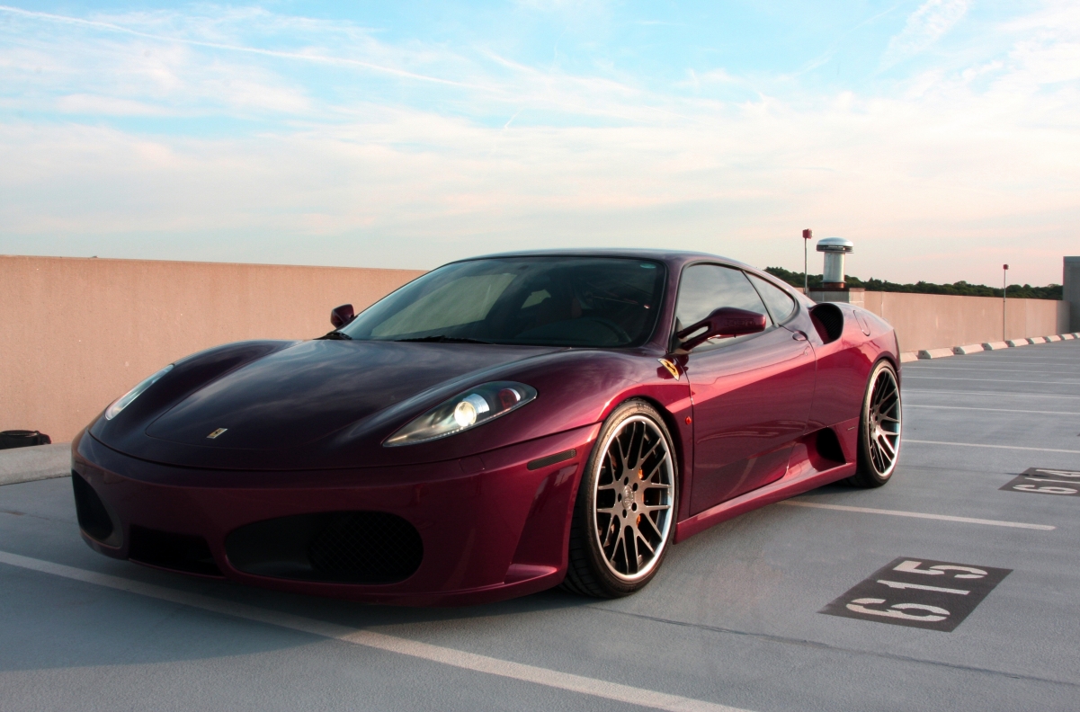 Dark red Ferrari F430 sports car 4