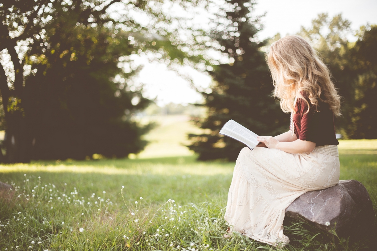 Girl reading a book 6K wallpaper