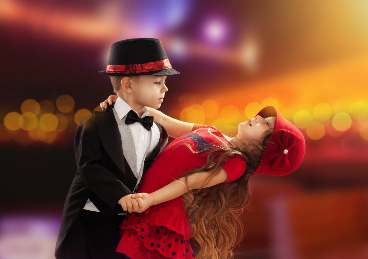 Little girl and boy romantic dance