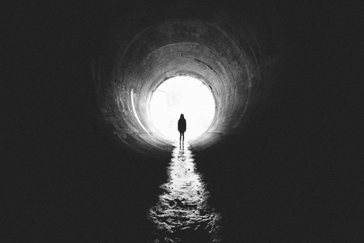 Light silhouette of a girl in a canal channel