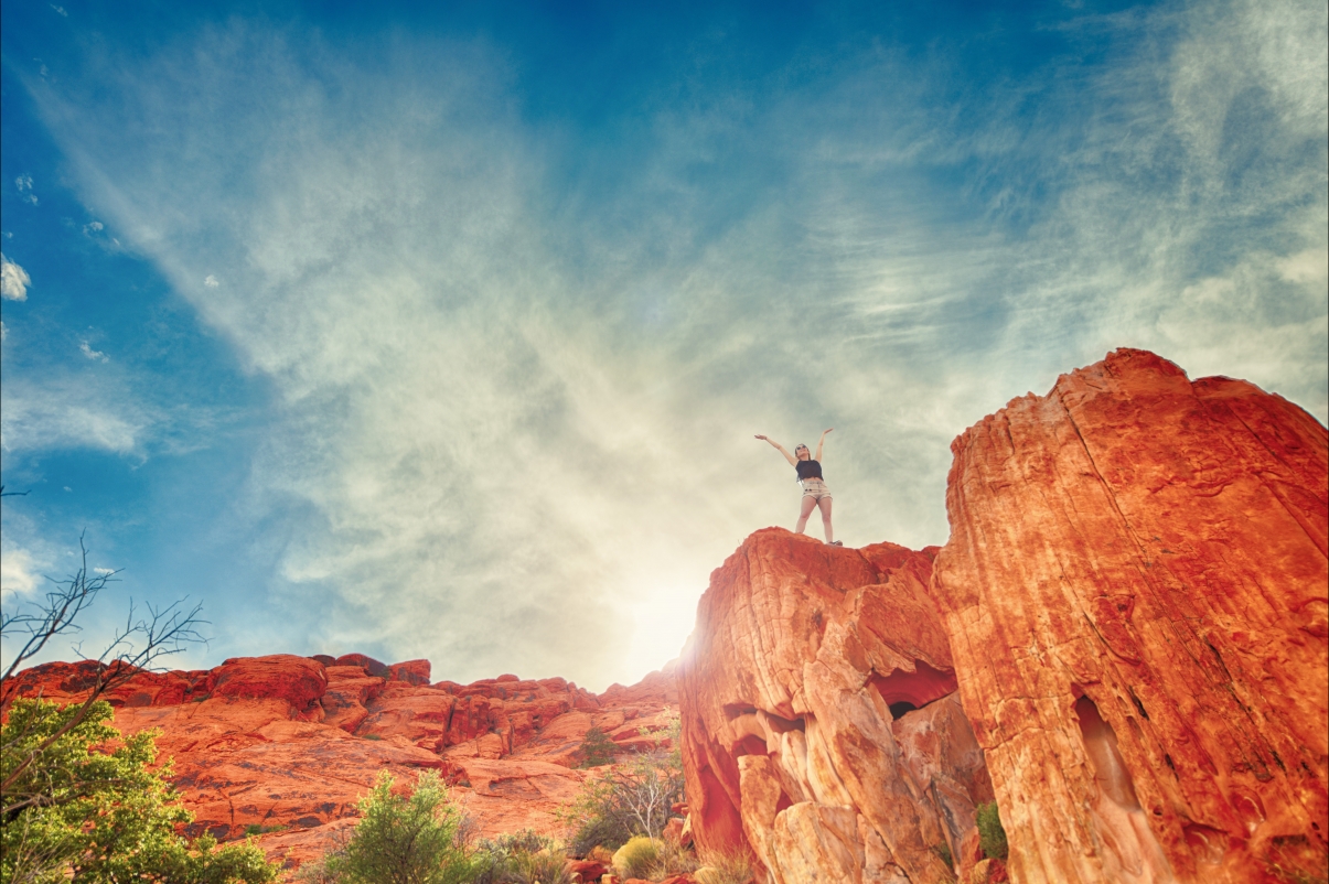 Woman standing high above the red stone