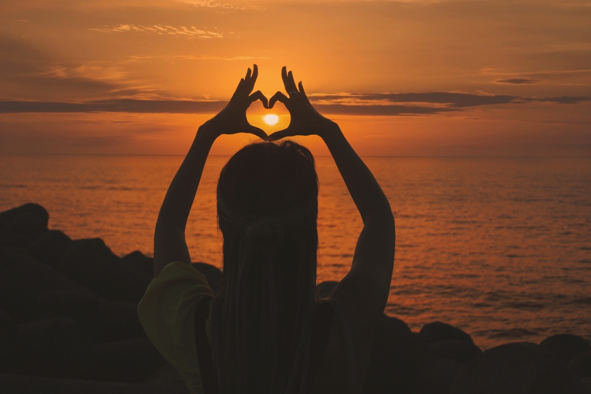 Woman sunset heart hand back 5k photo