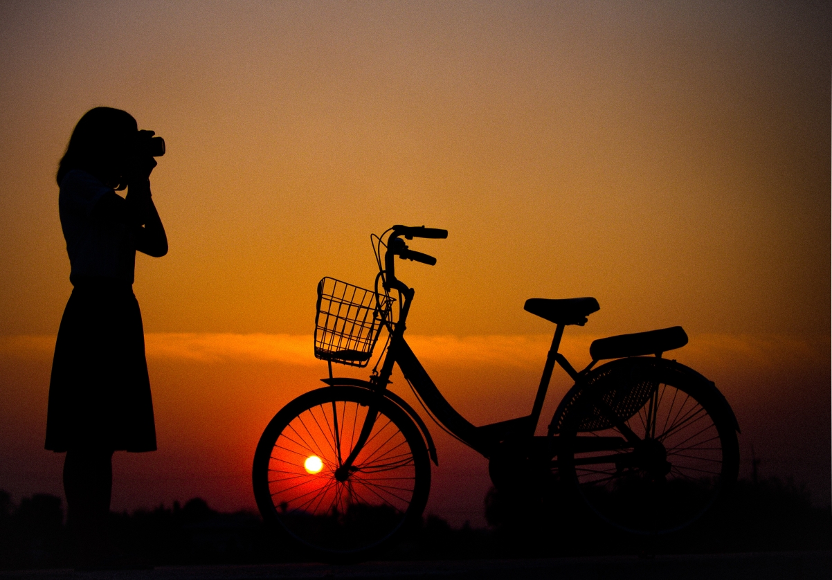 Girl bike trip dusk