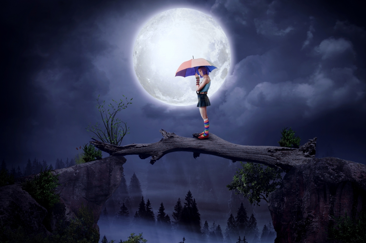 Girl with umbrella big moon tree beautiful