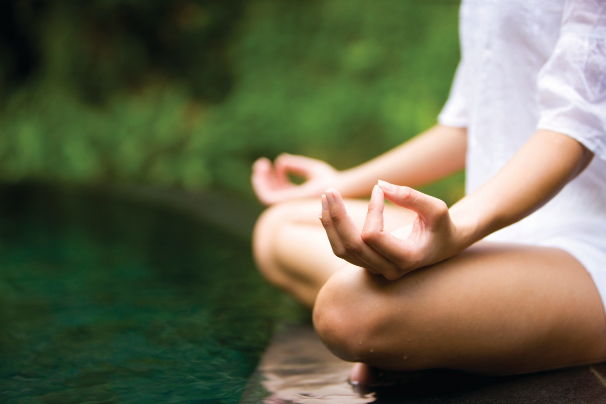 Girl sitting cross-legged 4k picture