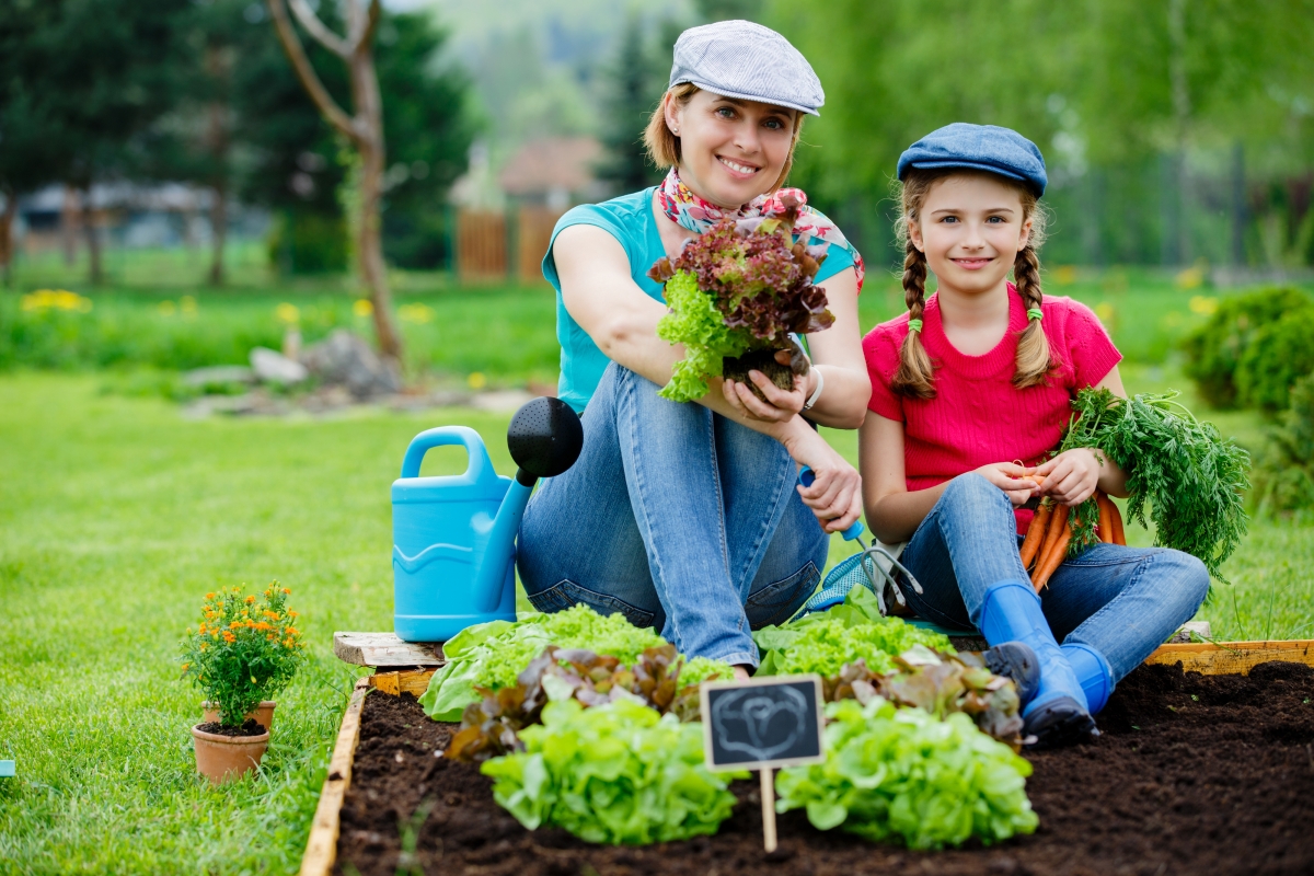 Lovely mother and daughter in the farm garden