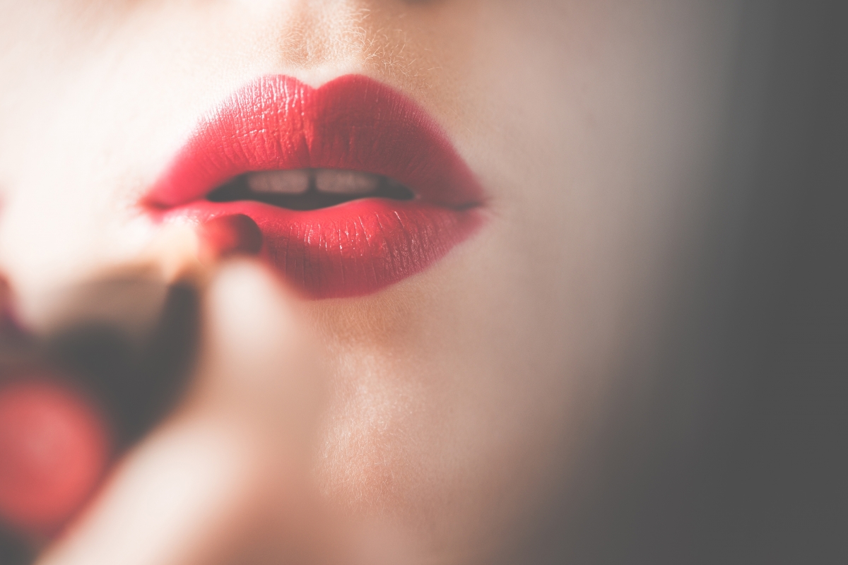 Young beautiful woman with red