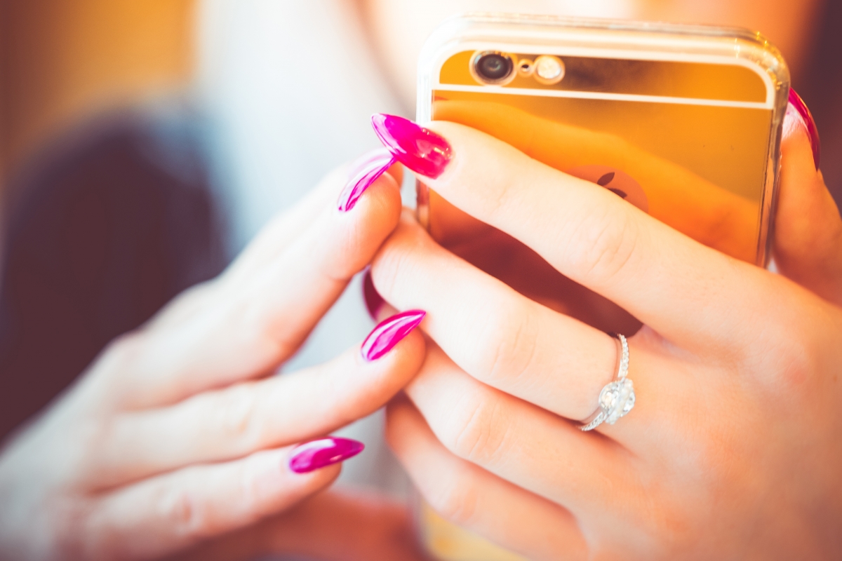 Young woman with golden smart hands