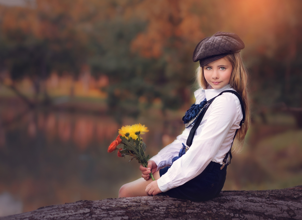Cute little girl with hat and overalls